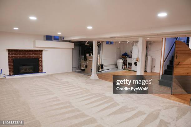 renovated and completely finished basement with vinyl flooring and plush carpeting - home furnace stock pictures, royalty-free photos & images