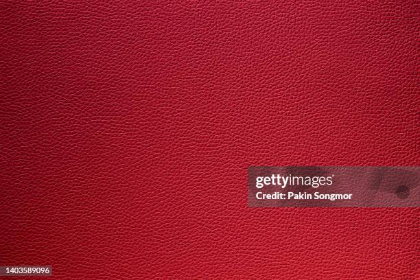 close-up of a dark red leather and textured background. - auto sofa stock pictures, royalty-free photos & images