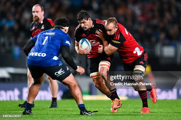 Pablo Matera of the Crusaders on attack with Tom Christie in support during the 2022 Super Rugby Pacific Final match between the Blues and the...