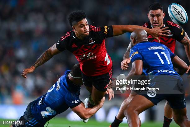 Leicester Fainga'anuku of the Crusaders is tackled during the 2022 Super Rugby Pacific Final match between the Blues and the Crusaders at Eden Park...