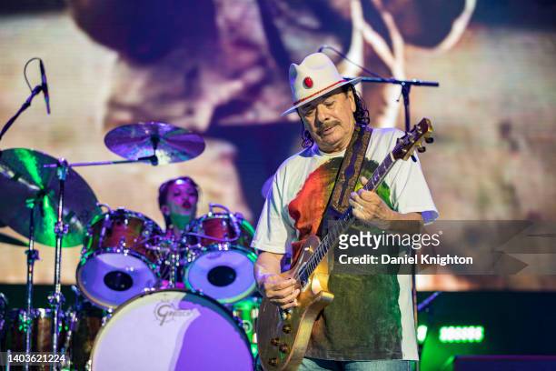 Guitarist Carlos Santana and drummer Cindy Blackman Santana of Santana perform on stage at North Island Credit Union Amphitheatre on June 17, 2022 in...