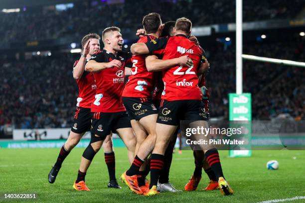 Crusaders players celebrate the try of Sevu Reece during the 2022 Super Rugby Pacific Final match between the Blues and the Crusaders at Eden Park on...