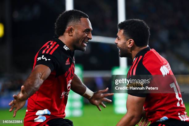 Sevu Reece and Richie Mo'unga of the Crusaders celebrate the win during the 2022 Super Rugby Pacific Final match between the Blues and the Crusaders...