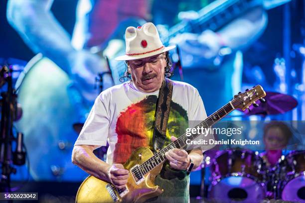 Guitarist Carlos Santana of Santana performs on stage at North Island Credit Union Amphitheatre on June 17, 2022 in Chula Vista, California.