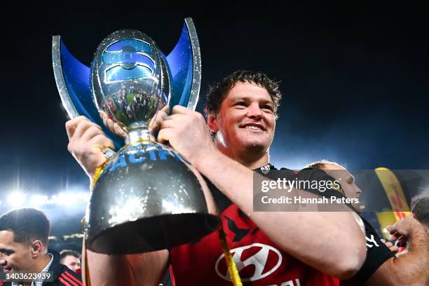 Scott Barrett of the Crusaders holds the Super Rugby Pacific trophy after winning the 2022 Super Rugby Pacific Final match between the Blues and the...