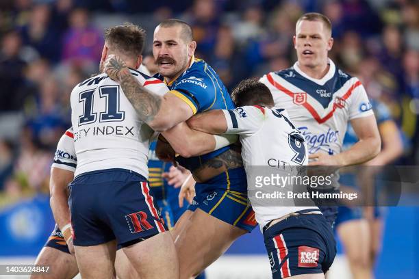 Reagan Campbell-Gillard of the Eels is tackled during the round 15 NRL match between the Parramatta Eels and the Sydney Roosters at CommBank Stadium,...
