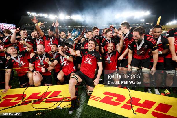 Scott Barrett of the Crusaders holds the Super Rugby Pacific trophy after winning the 2022 Super Rugby Pacific Final match between the Blues and the...