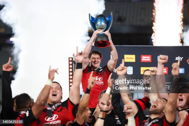 Scott Barrett of the Crusaders holds the Super Rugby Pacific trophy after winning the 2022 Super Rugby Pacific Final match between the Blues and the...