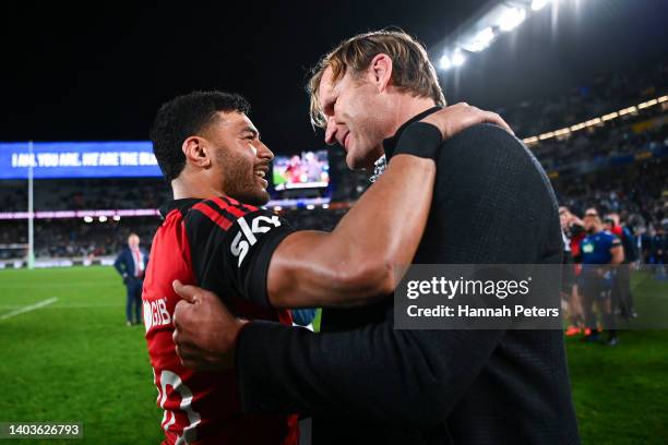 Richie Mo'unga and Coach Scott Robertson of the Crusaders celebrate the win after the 2022 Super Rugby Pacific Final match between the Blues and the...