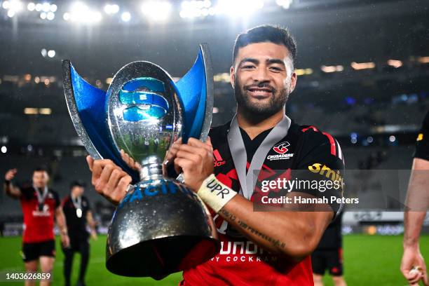 Richie Mo'unga of the Crusaders holds the Super Rugby Pacific trophy after the 2022 Super Rugby Pacific Final match between the Blues and the...