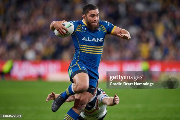 Isaiah Papali'i of the Eels makes a break during the round 15 NRL match between the Parramatta Eels and the Sydney Roosters at CommBank Stadium, on...