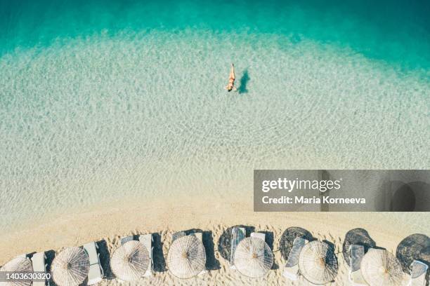 woman swimming in beautiful clear water. - daily life in turkey stock pictures, royalty-free photos & images