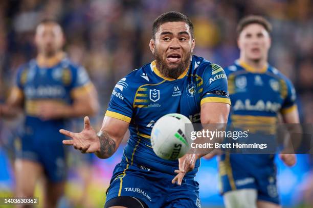 Isaiah Papali'i of the Eels passes the ball during the round 15 NRL match between the Parramatta Eels and the Sydney Roosters at CommBank Stadium, on...