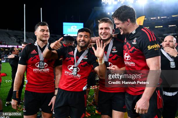 To R, David Havili, Richie Mo'unga, Jack Goodhue and Scott Barrett of the Crusaders celebrate after the 2022 Super Rugby Pacific Final match between...