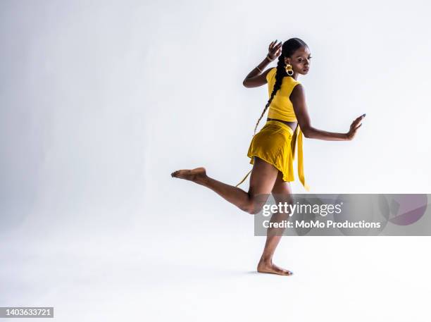 studio portrait of fashionable female professional dancer - woman standing exercise stock pictures, royalty-free photos & images