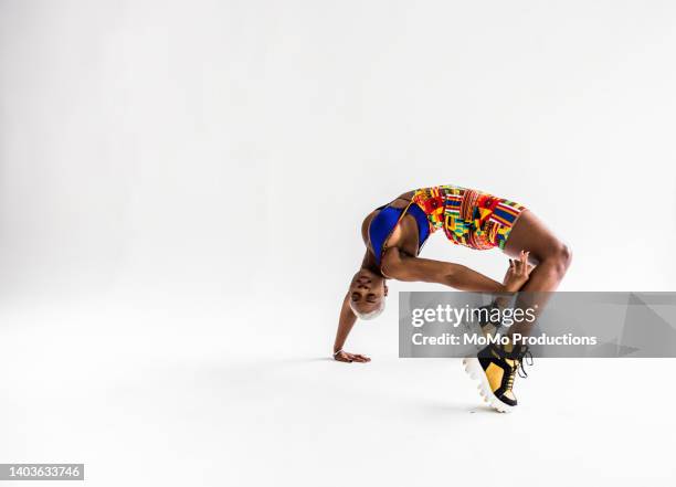 studio portrait of fashionable female professional dancer - bending over backwards stock pictures, royalty-free photos & images