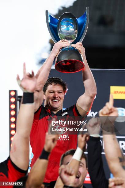 Scott Barrett of the Crusaders holds the Super Rugby Pacific trophy after winning the 2022 Super Rugby Pacific Final match between the Blues and the...