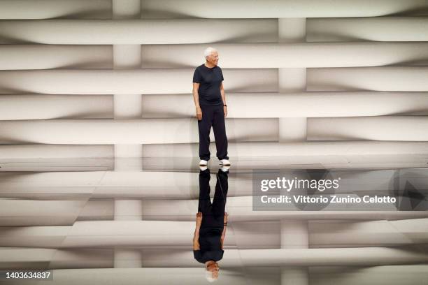 Fashion designer Giorgio Armani acknowledge the applause of the audience at the Emporio Armani fashion show during the Milan Fashion Week S/S 2023 on...