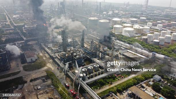 Aerial view of firefighters battling a fire at the ethylene glycol plant of the chemical department of Sinopec Shanghai Petrochemical Co., Ltd in...