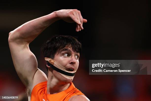 Sam Taylor of the Giants is seen with strapping on his face during the round 14 AFL match between the Greater Western Sydney Giants and the Western...