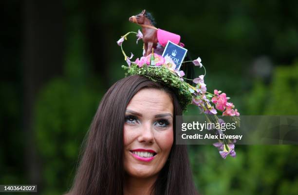 Racegoer with a horse hat arrives on day five of Royal Ascot 2022 at Ascot Racecourse on June 18, 2022 in Ascot, England.