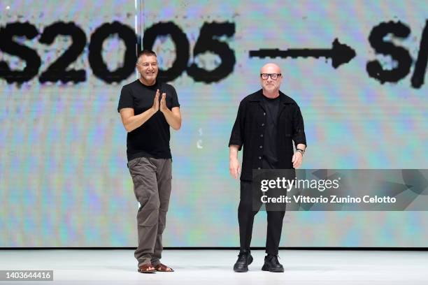 Fashion designers Stefano Gabbana and Domenico Dolce acknowledge the applause of the audience at the Dolce & Gabbana fashion show during the Milan...