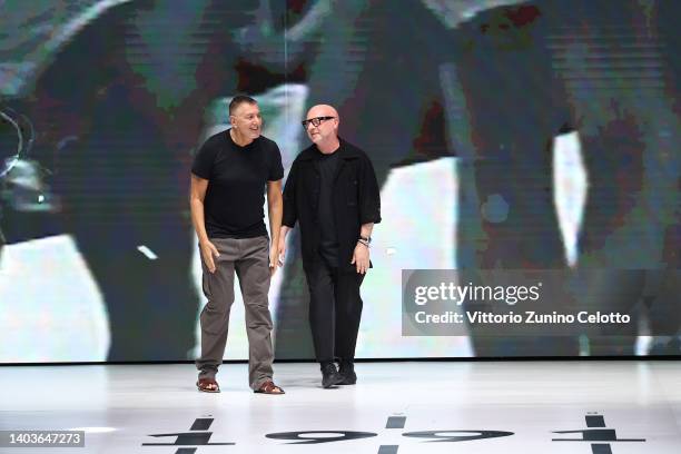 Fashion designers Stefano Gabbana and Domenico Dolce acknowledge the applause of the audience at the Dolce & Gabbana fashion show during the Milan...