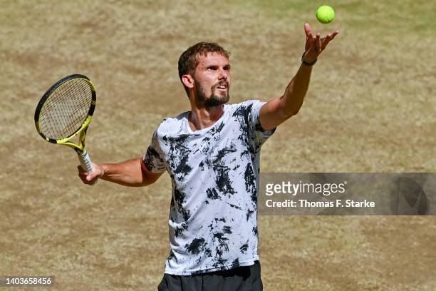 Oscar Otte of Germany serves in his match against Daniil Medvedev of Russia during day eight of the 29th Terra Wortmann Open at OWL-Arena on June 18,...