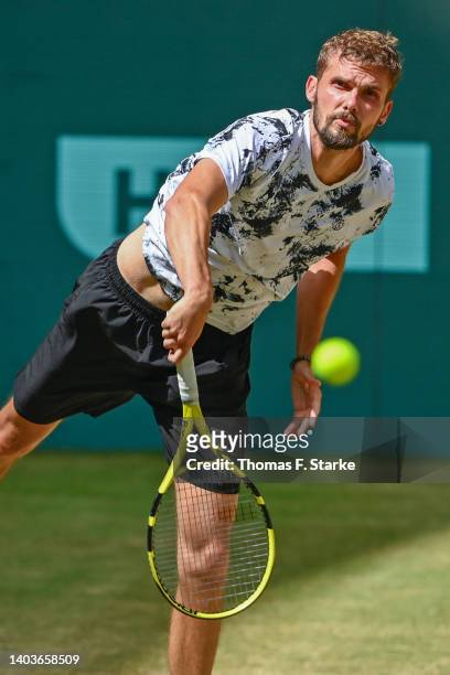 Oscar Otte of Germany serves in his match against Daniil Medvedev of Russia during day eight of the 29th Terra Wortmann Open at OWL-Arena on June 18,...