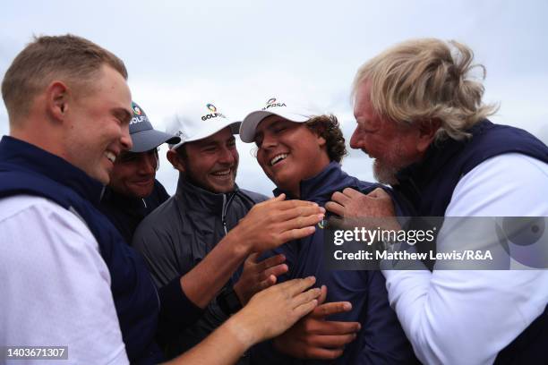 Aldrich Potgieter of South Africa is congratulated by fellow team mates, after winning dthe Final of day six of the R&A Amateur Championship at Royal...