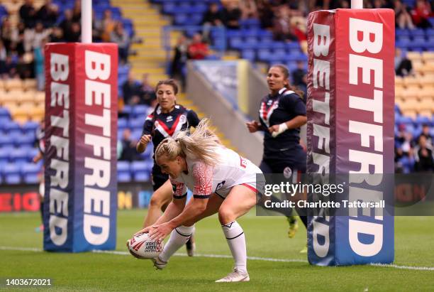 Amy Hardcastle of England scores their side's third try during the Women's International Friendly match between England and France at The Halliwell...