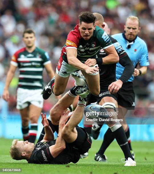 Aled Davies of Saracens challenges Freddie Burns of Leicester Tigers during the Gallagher Premiership Rugby Final match between Leicester Tigers and...