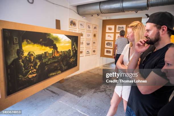 The painting 'Guernica Gaza - A Family of Farmers' by Mohammed Al Hawajri from the series “Guernica Gaza” hangs at the Documenta 15 modern art fair...