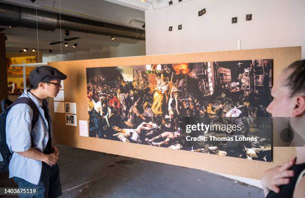 The painting 'Liberty Leading the People - Eugene Delacroix ' by Mohammed Al Hawajri from the series 'Guernica Gaza ' hangs at the Documenta 15...