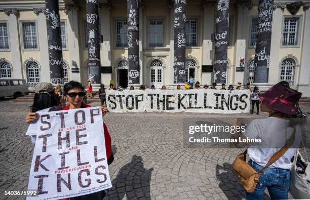 Activist and artist demonstrate in front of the 'Fridericianum' with banner 'Stop The Killings' against the Philippe 'drug war' as an event during...