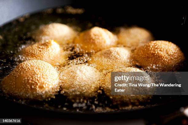 frying sesame balls - new york state fair stock pictures, royalty-free photos & images