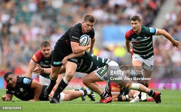 Owen Farrell of Saracens is tackled by Julian Montoya of Leicester Tigers during the Gallagher Premiership Rugby Final match between Leicester Tigers...