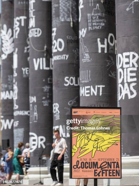 Documenta poster hangs in front of the pillars of the Fridericianum during the opening day of the Documenta 15 modern art fair on June 18, 2022 in...