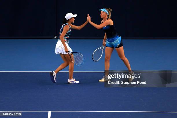 Elise Mertens of Belgium and partner Shuai Zhang of China play against Latisha Chan of Chinese Taipei and partner Samantha Stosur of Australia in the...