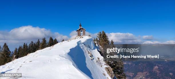 chapel on snow covered mountain peak - bavaria winter stock pictures, royalty-free photos & images