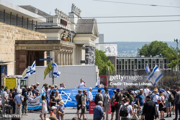 Group of people demonstrate pro Israel near the Documenta 15 modern art fair on June 18, 2022 in Kassel, Germany. The “Guernica Gaza” series shows...