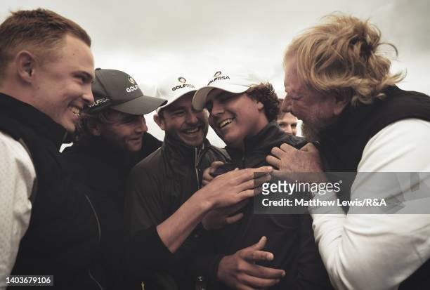 Aldrich Potgieter of South Africa is congratulated by fellow team mates, after winning the Final of day six of the R&A Amateur Championship at Royal...
