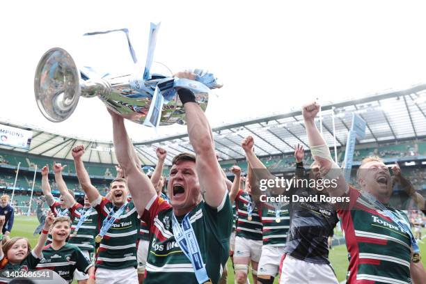 Freddie Burns of Leicester Tigers celebrate as they lift the Gallagher Premiership Trophy in front of the Leicester Tigers fans after the final...