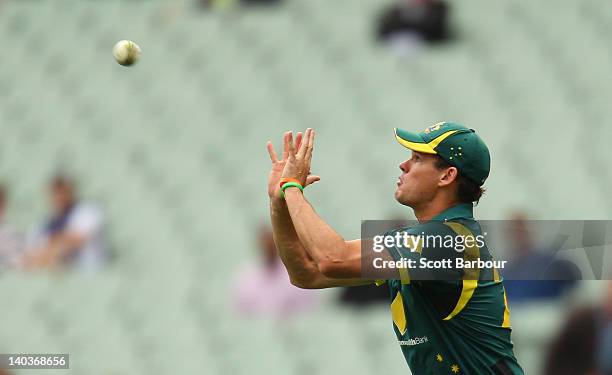 Clint McKay of Australia takes a catch to dismiss Dinesh Chandimal during the One Day International match between Australia and Sri Lanka at...