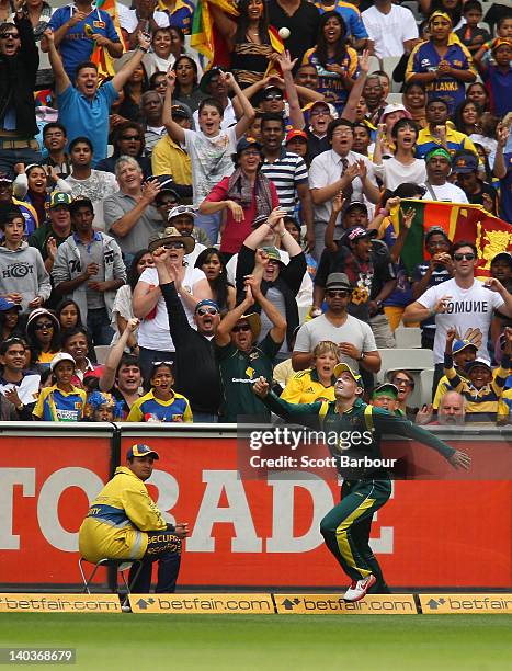 Michael Hussey of Australia takes a catch to dismiss Thisara Perera of Sril Lanka during the One Day International match between Australia and Sri...