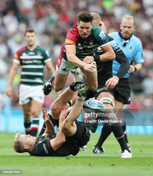 Aled Davies of Saracens challenges Freddie Burns of Leicester Tigers during the Gallagher Premiership Rugby Final match between Leicester Tigers and...