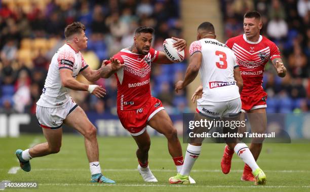 Jack Welsby and Kallum Watkins of England challenges Kenny Edwards of Combined Nations All Stars during the Men's International Friendly match...