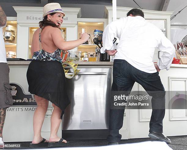 Rachel Ray and Emeril Lagasse attend the Whole Foods Grand Tasting Village at the 2012 South Beach Wine and Food Festival on February 25,2012 in...
