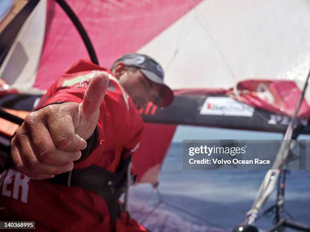 Mike Pammenter gives a thumbs up to a good sked report onboard CAMPER with Emirates Team New Zealand during leg 4 of the Volvo Ocean Race 2011-12,...