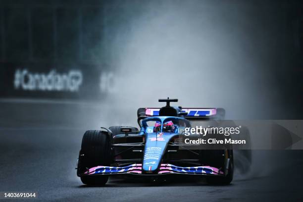 Fernando Alonso of Spain driving the Alpine F1 A522 Renault in the wet during final practice ahead of the F1 Grand Prix of Canada at Circuit Gilles...